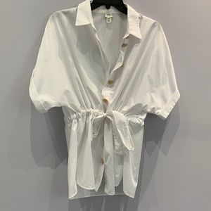 White button down with gold detail buttons and tie belt